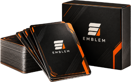 A finished set of printed Emblem player cards beside their presentation box