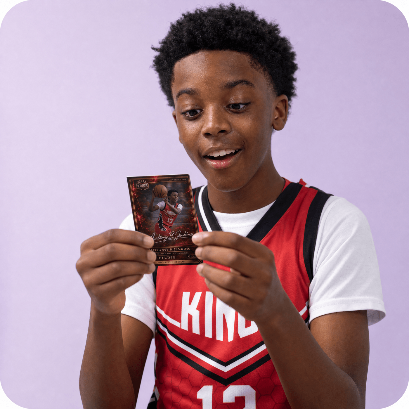Marcus Reed holding their custom card